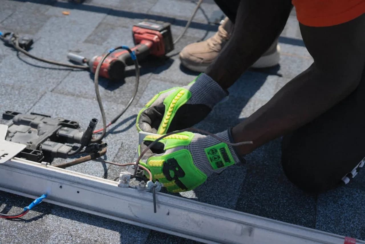 Certified service technician repairing a commercial door operator at a Canadian facility