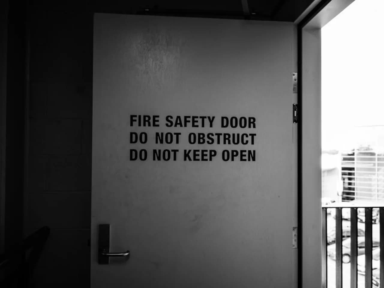 NFPA 80 fire-rated steel commercial door with intact label in a Canadian institutional corridor